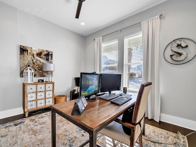 office space featuring dark hardwood / wood-style flooring and ceiling fan