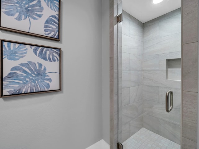 bathroom featuring an enclosed shower