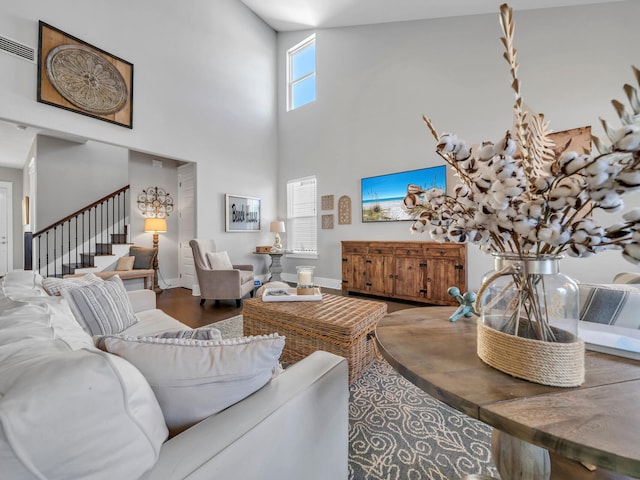 living room with high vaulted ceiling