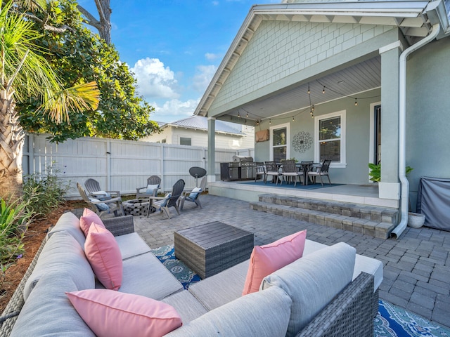 view of patio / terrace featuring ceiling fan and an outdoor living space