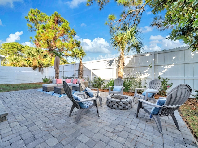 view of patio / terrace featuring an outdoor living space with a fire pit