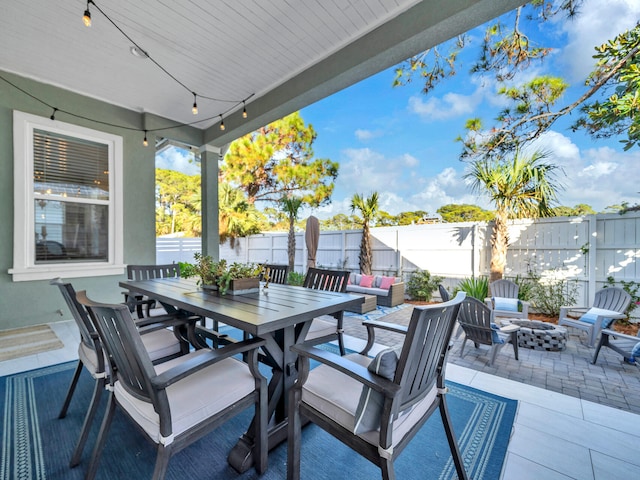 view of patio / terrace with an outdoor fire pit