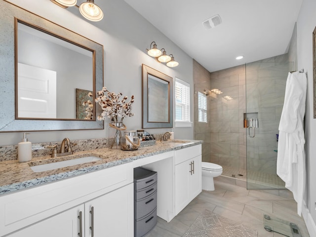 bathroom featuring walk in shower, vanity, and toilet