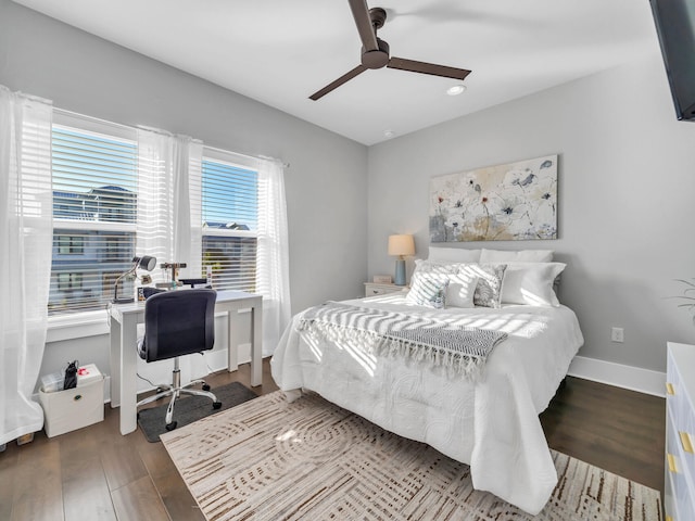 bedroom featuring dark wood-type flooring and ceiling fan