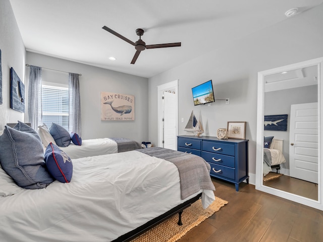 bedroom featuring dark wood-type flooring and ceiling fan