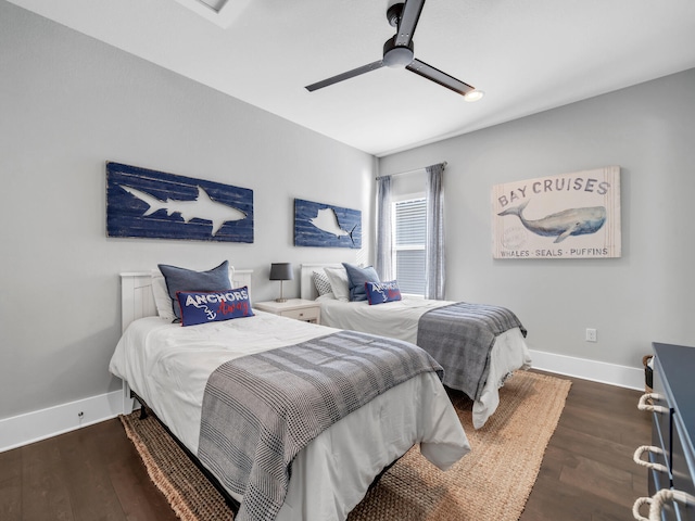 bedroom with ceiling fan and dark hardwood / wood-style flooring