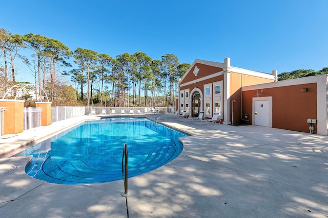 view of swimming pool with a patio