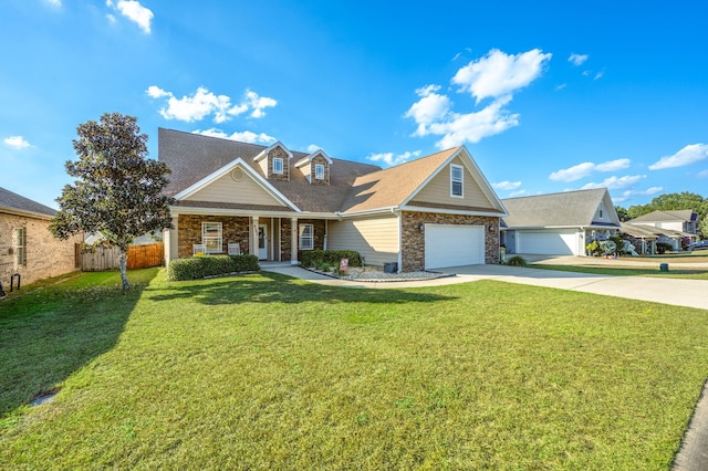 view of front of property with a front yard and a garage