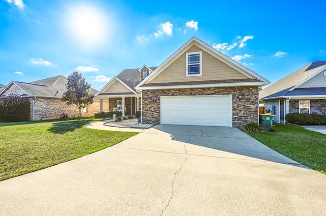 view of front of property with a front yard and a garage