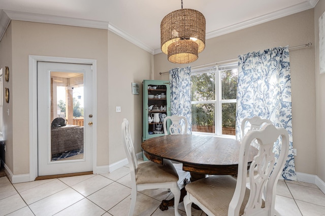 dining area with light tile patterned floors and ornamental molding