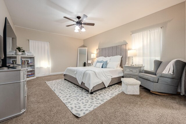 carpeted bedroom with ceiling fan