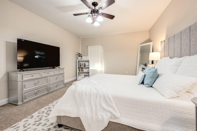 bedroom with light carpet and ceiling fan