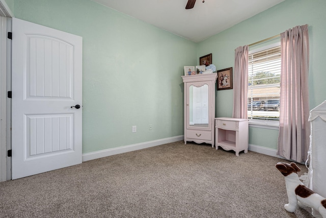 unfurnished bedroom featuring carpet flooring and ceiling fan