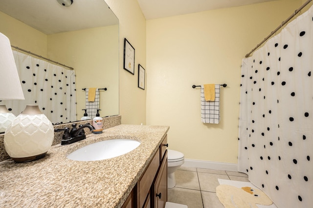 bathroom with toilet, vanity, tile patterned floors, and a shower with curtain