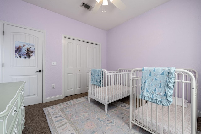 carpeted bedroom with ceiling fan and a closet