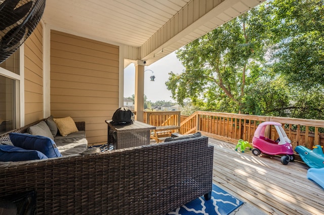 wooden deck featuring an outdoor living space