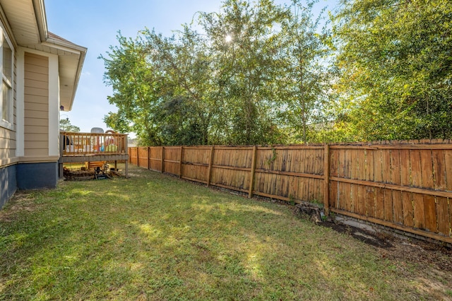 view of yard featuring a wooden deck