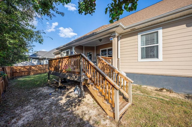 exterior space with a lawn and a deck