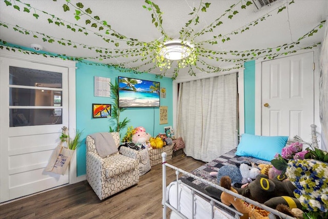 bedroom featuring hardwood / wood-style flooring