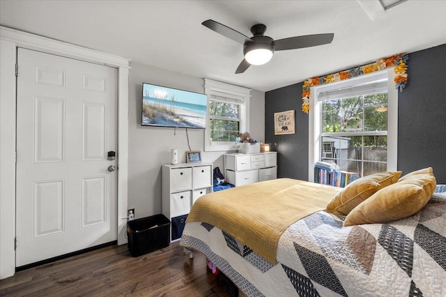 bedroom featuring dark wood-type flooring and ceiling fan