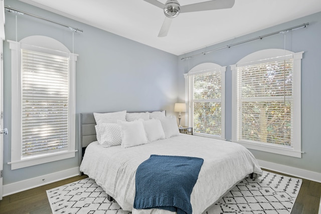 bedroom featuring dark hardwood / wood-style flooring and ceiling fan