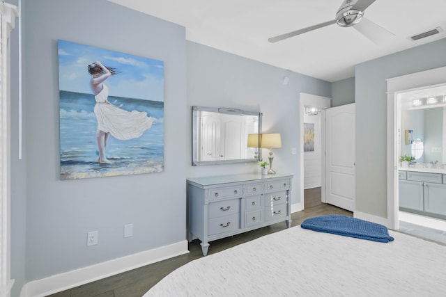 bedroom featuring ensuite bathroom, ceiling fan, and dark hardwood / wood-style floors