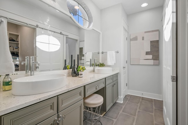 bathroom featuring tile patterned flooring and vanity