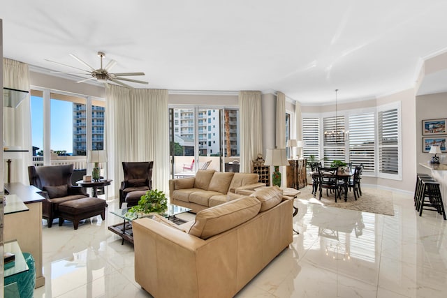 living room featuring ceiling fan with notable chandelier and a healthy amount of sunlight