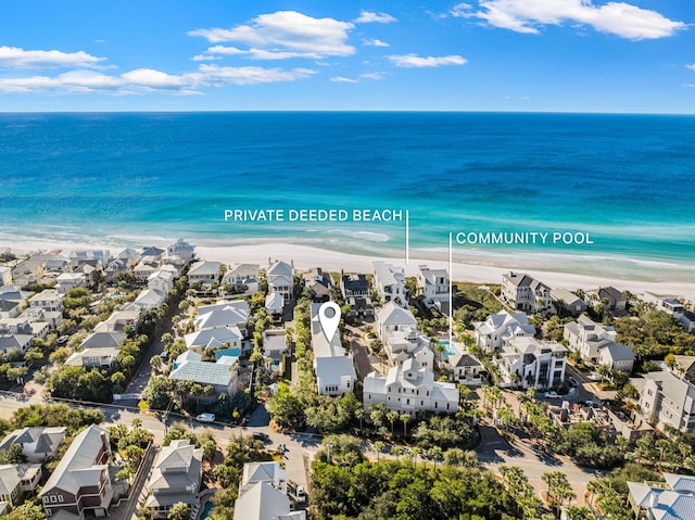 aerial view with a beach view and a water view