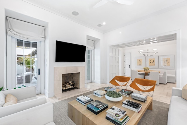 45 N Charles St, Inlet Beach, FL 32461 - living room with a fireplace, a chandelier, and crown molding