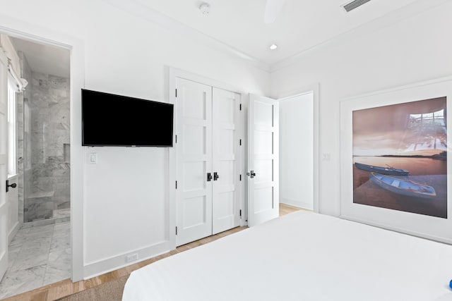 45 N Charles St, Inlet Beach, FL 32461 - bedroom featuring a closet, ensuite bathroom, and baseboards