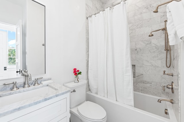 full bathroom featuring vanity, toilet, and shower / bath combination with curtain