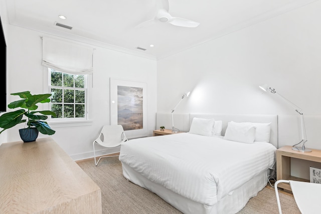 bedroom with ornamental molding and ceiling fan