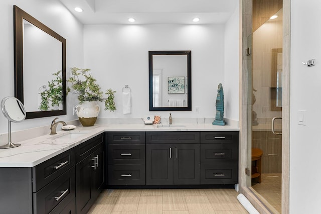 bathroom with vanity and an enclosed shower