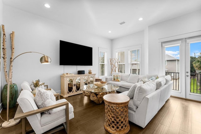 living room with dark hardwood / wood-style flooring