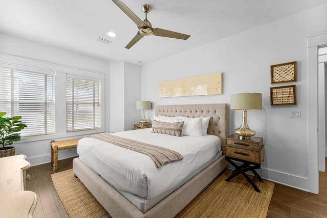 bedroom with ceiling fan and dark wood-type flooring