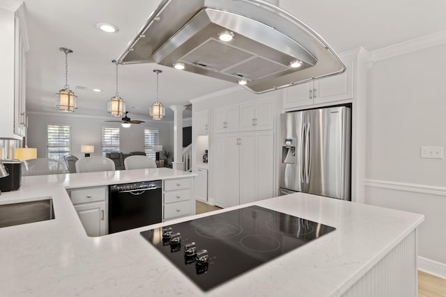 kitchen with light stone countertops, island range hood, white cabinets, and black appliances