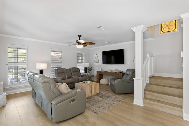 living room with light wood-type flooring, ceiling fan, and crown molding