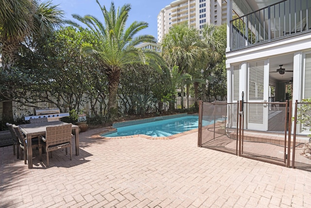 view of pool with ceiling fan and a patio area