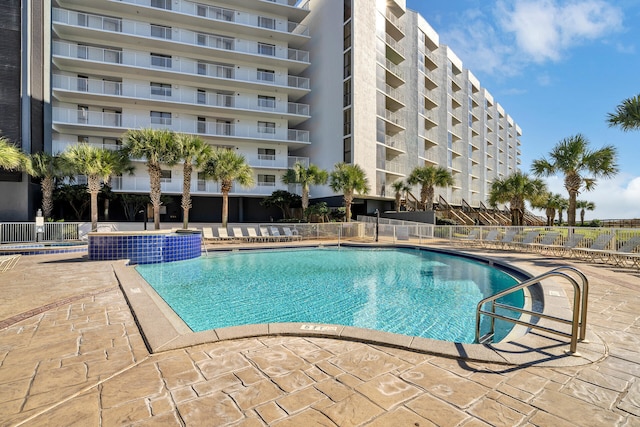 view of swimming pool with a patio area