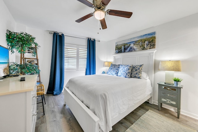 bedroom featuring ceiling fan and wood-type flooring