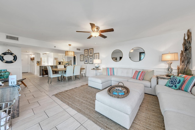 living room with ceiling fan