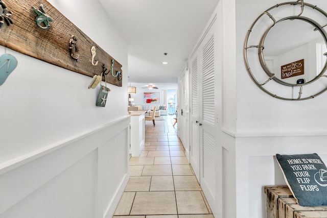 hallway with light tile patterned floors