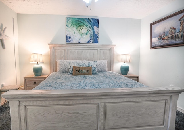 carpeted bedroom with a textured ceiling