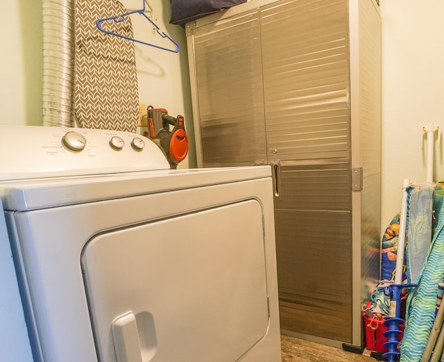 washroom featuring washer / clothes dryer and hardwood / wood-style flooring