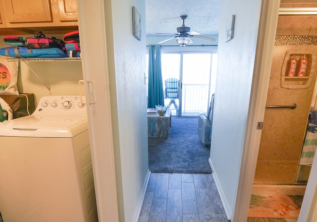 laundry area featuring cabinets, hardwood / wood-style floors, ceiling fan, and washer / dryer