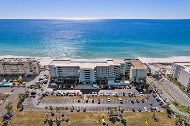 birds eye view of property with a view of the beach and a water view