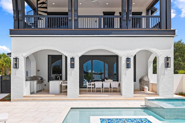 48 Paradise By The Sea Blvd, Inlet Beach, FL 32461 - back of property with area for grilling, a balcony, and a patio