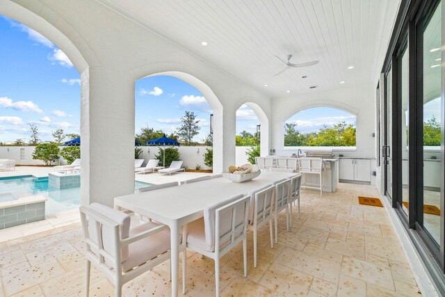 48 Paradise By The Sea Blvd, Inlet Beach, FL 32461 - view of patio / terrace featuring exterior kitchen, ceiling fan, outdoor dining area, a fenced backyard, and a pool with connected hot tub