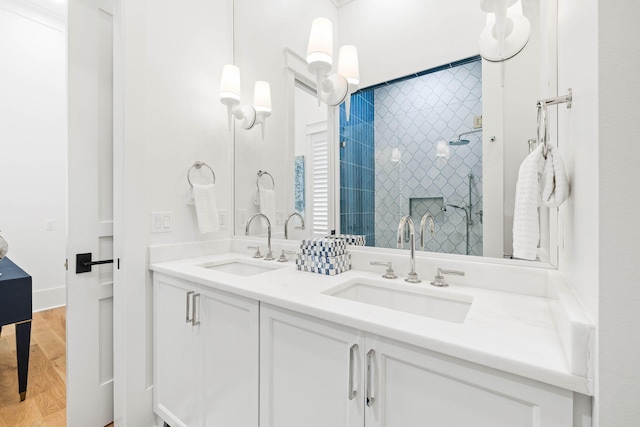 48 Paradise By The Sea Blvd, Inlet Beach, FL 32461 - full bathroom featuring a tile shower, double vanity, and wood finished floors